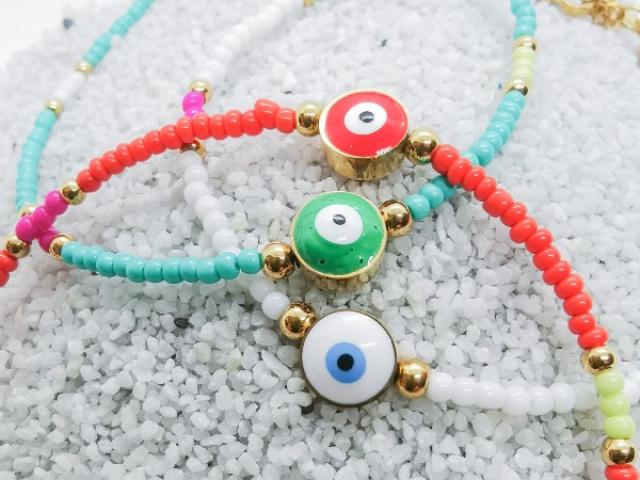 Bracelet en petites perles de plusieurs couleurs & Talisman Oeil